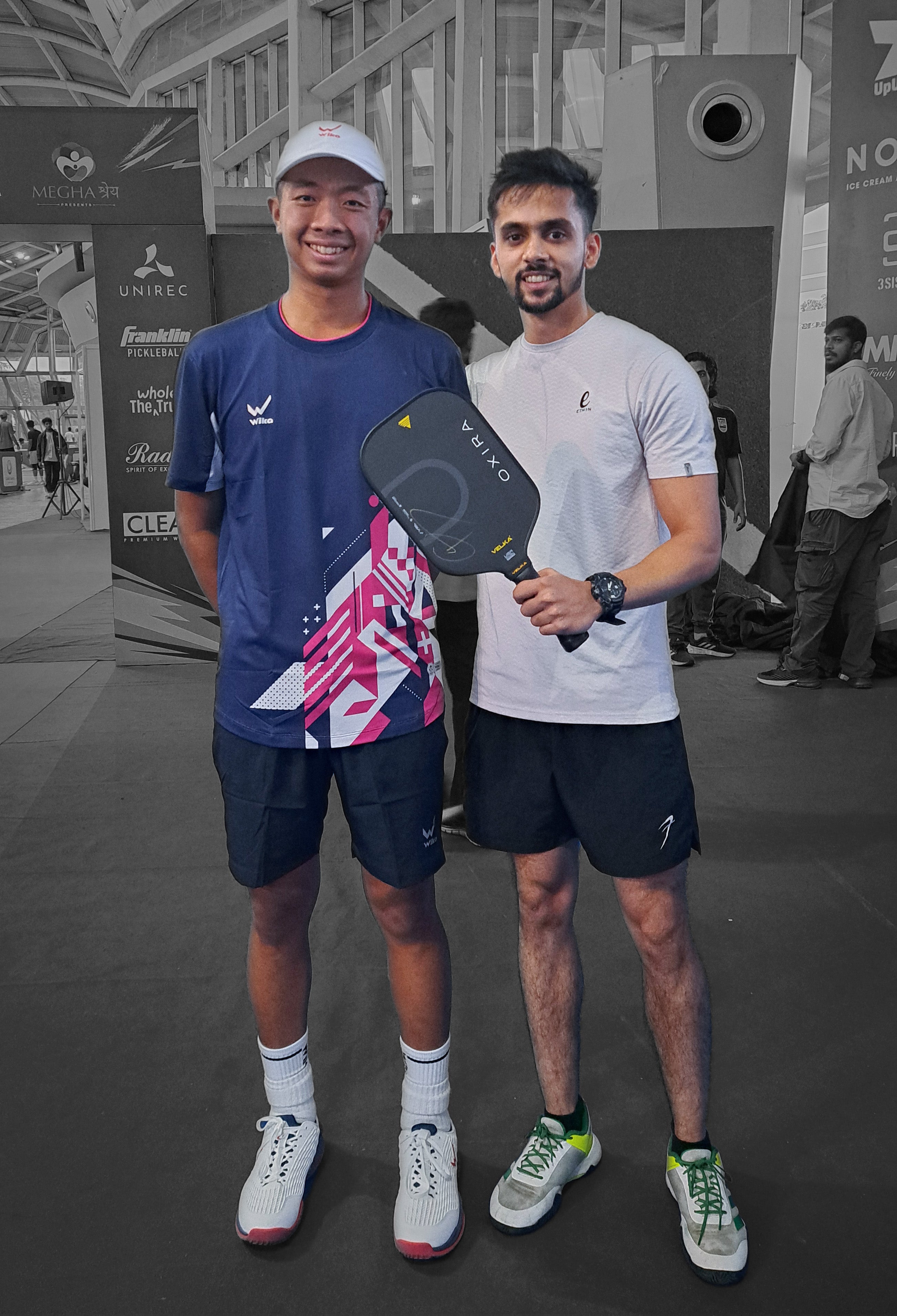 Velka's Founder with Quang Duong standing with Velka's Oxira Pickleball Paddle
