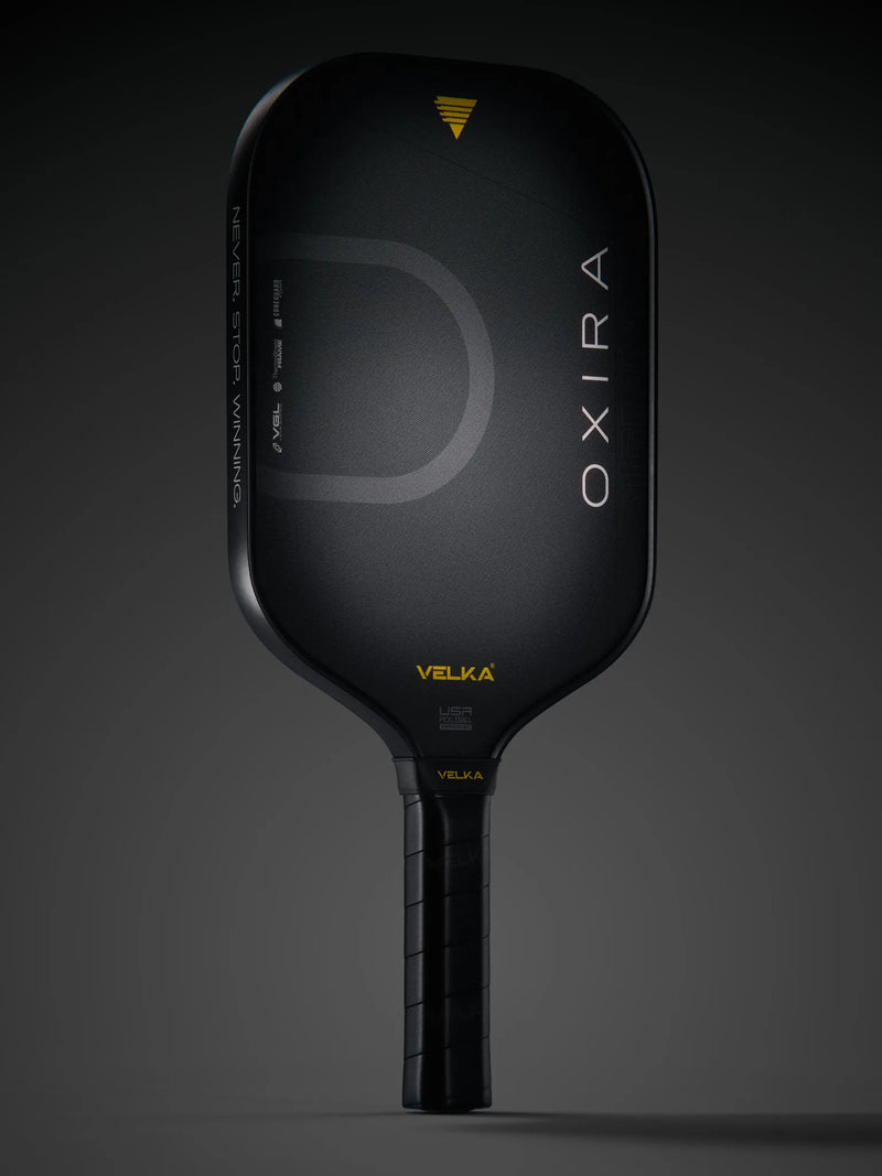 Velka's Oxira pickleball paddle in a dark background.